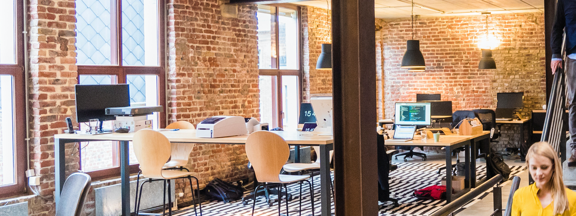 Photo of woman in yellow top walking down stairs in a office 2451567 Photo of woman in yellow top walking down stairs in a office 2451567